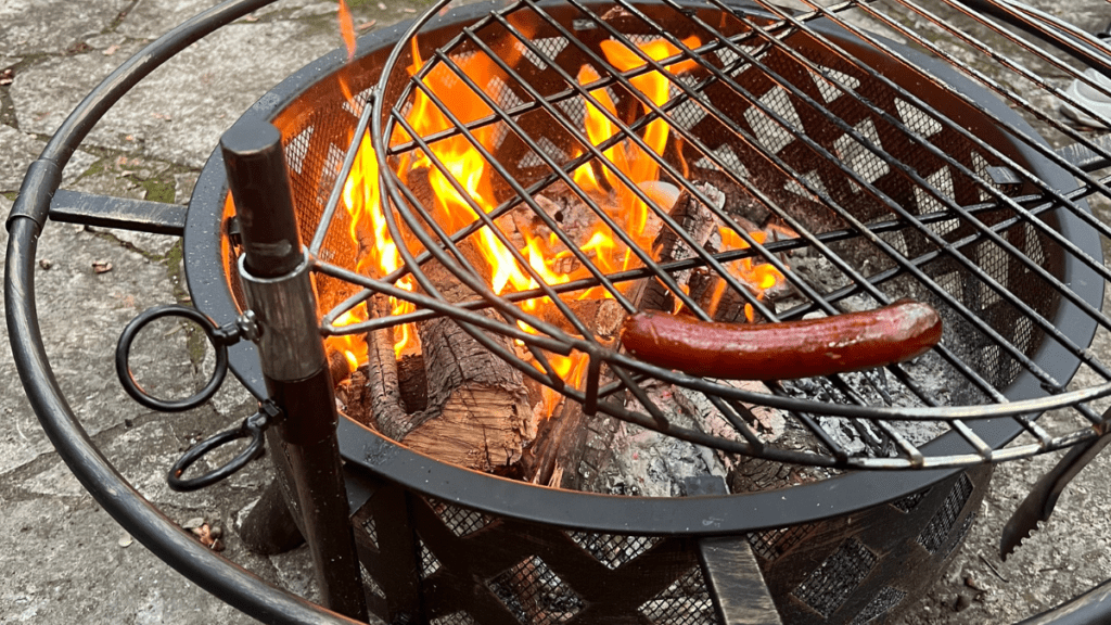 A simple backyard fire pit with a blazing fire.