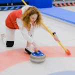 A woman curling.