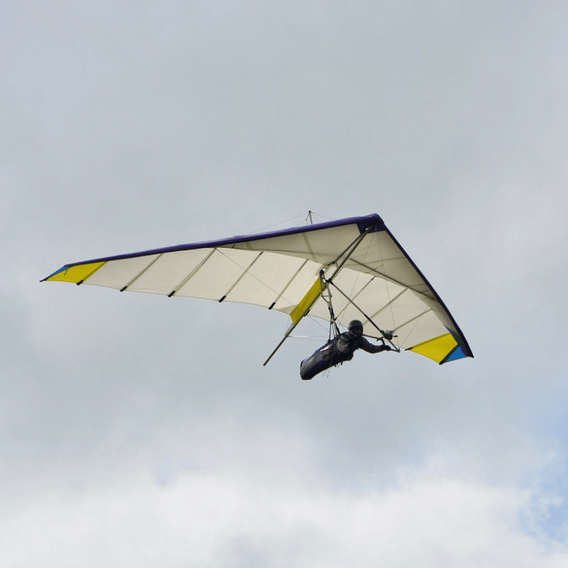 A man hang glides.