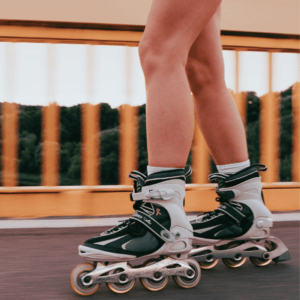 A girl wears the best kids rollerblades for her age and ability.