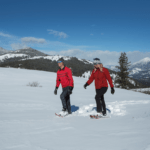 A couple snowshoeing.