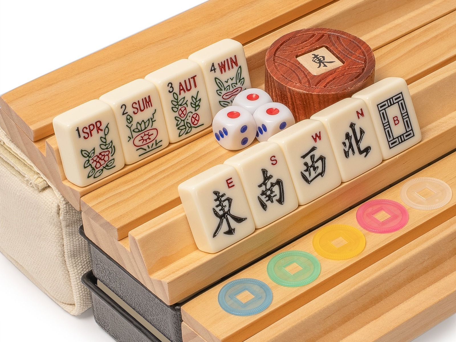 American mahjong wind and season tiles on wooden racks with dice and scoring coins