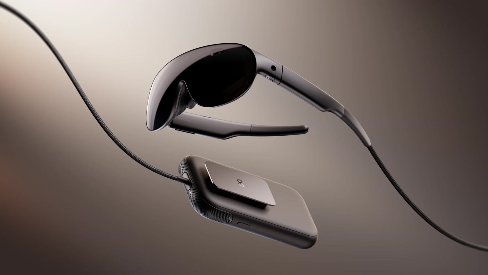 Meta VR Glasses with their tethered compute puck on a dark background